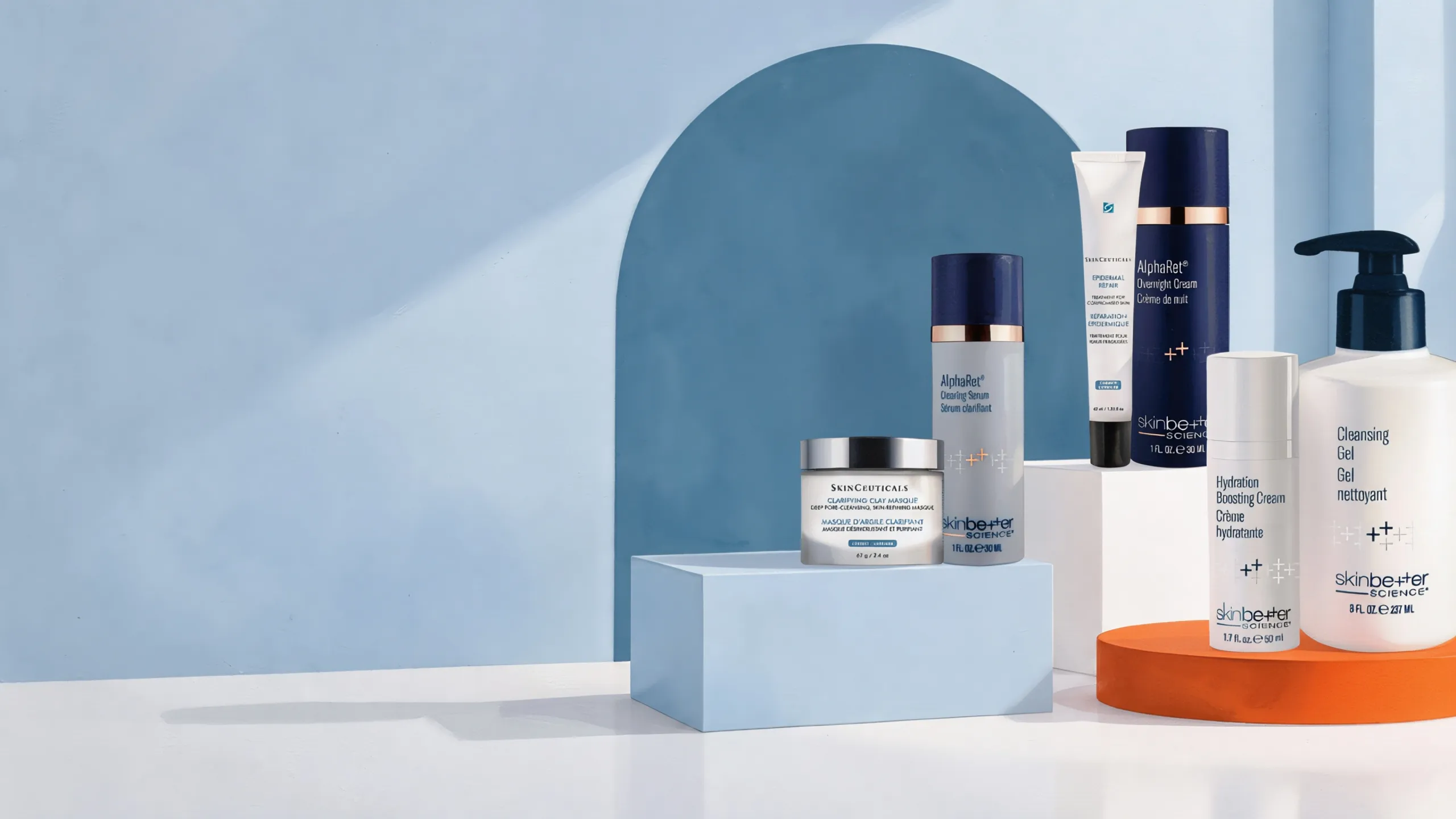 Atelier Med · Preparation: serums, mask and cleanser on a deep blue arch, skin prep care before peeling, microneedling or laser. Curated selection distributed in the Le Centre MD clinics in Québec.